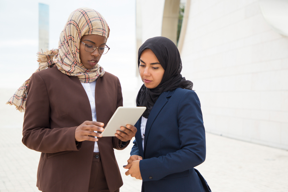 women on a tablet - Saudi Labor Law End of Service